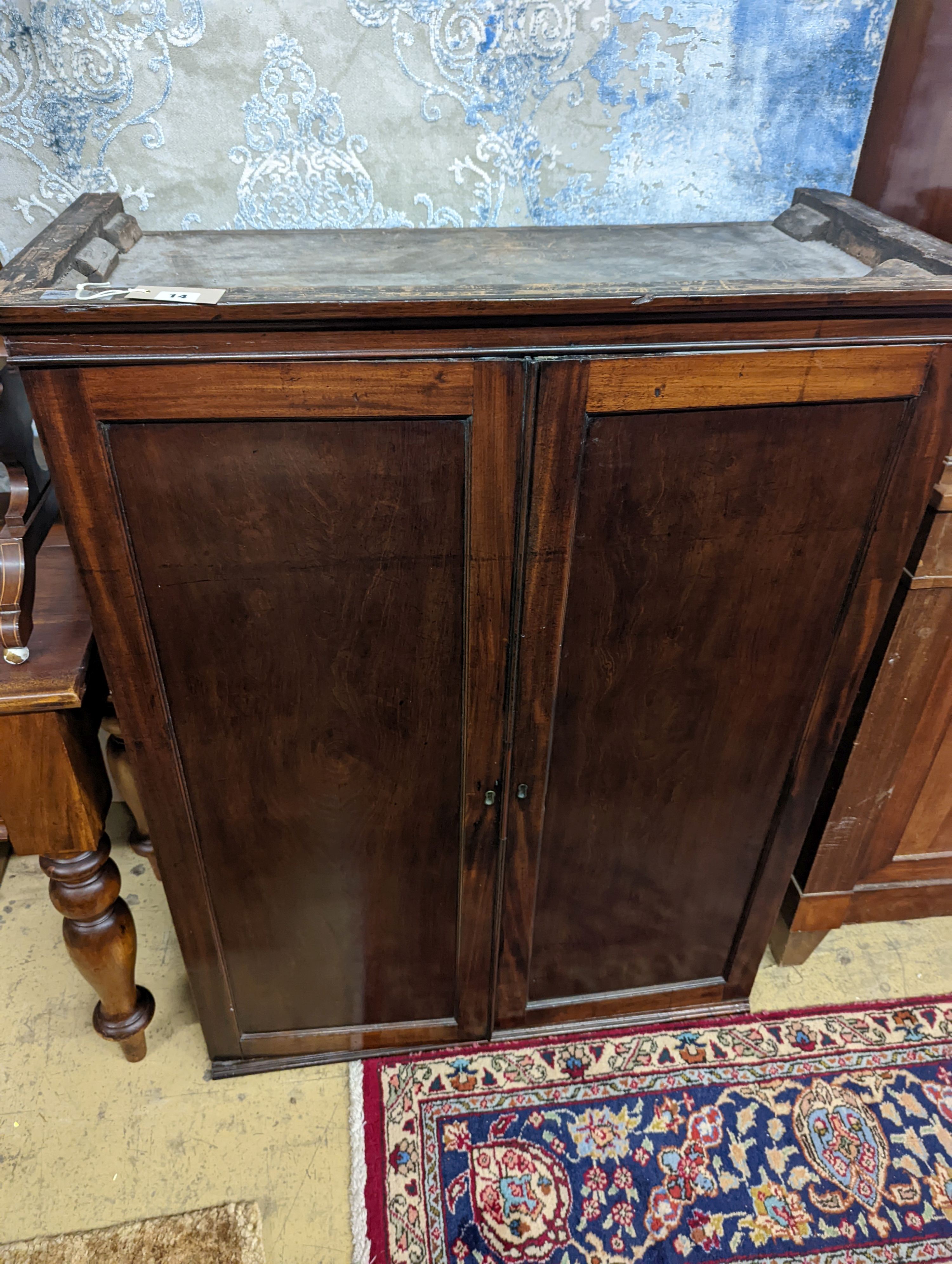 An early 19th century mahogany two door cabinet top section with pigeonhole interior, width 89cm, depth 42cm, height 113cm